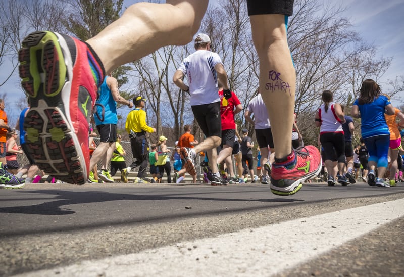 Runners leave the starting line of the 2014 Boston Marathon in Hopkinton, Massachusetts. Increased security costs since the 2013 Boston Marathon bombing are partly to blame for the cost of races today, race directors say. (© Marcio Silva | Dreamstime.com)