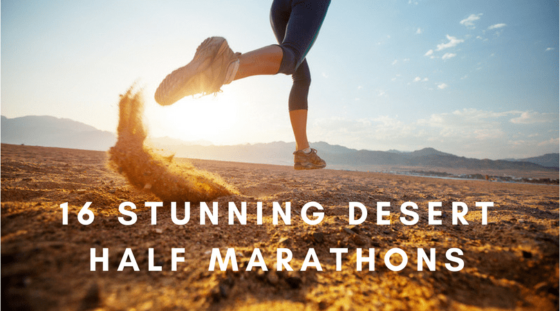 A person running on a desert terrain with dust kicked up from their shoe, the sun setting behind. The text overlay reads, "16 Stunning Desert Half Marathons".