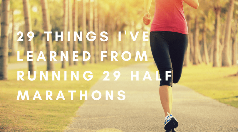 A person runs on a path surrounded by trees in bright sunlight. The text overlay reads, "29 Things I've Learned from Running 29 Half Marathons." The runner, wearing black leggings and a red tank top, is mid-stride, with only their legs and torso visible.