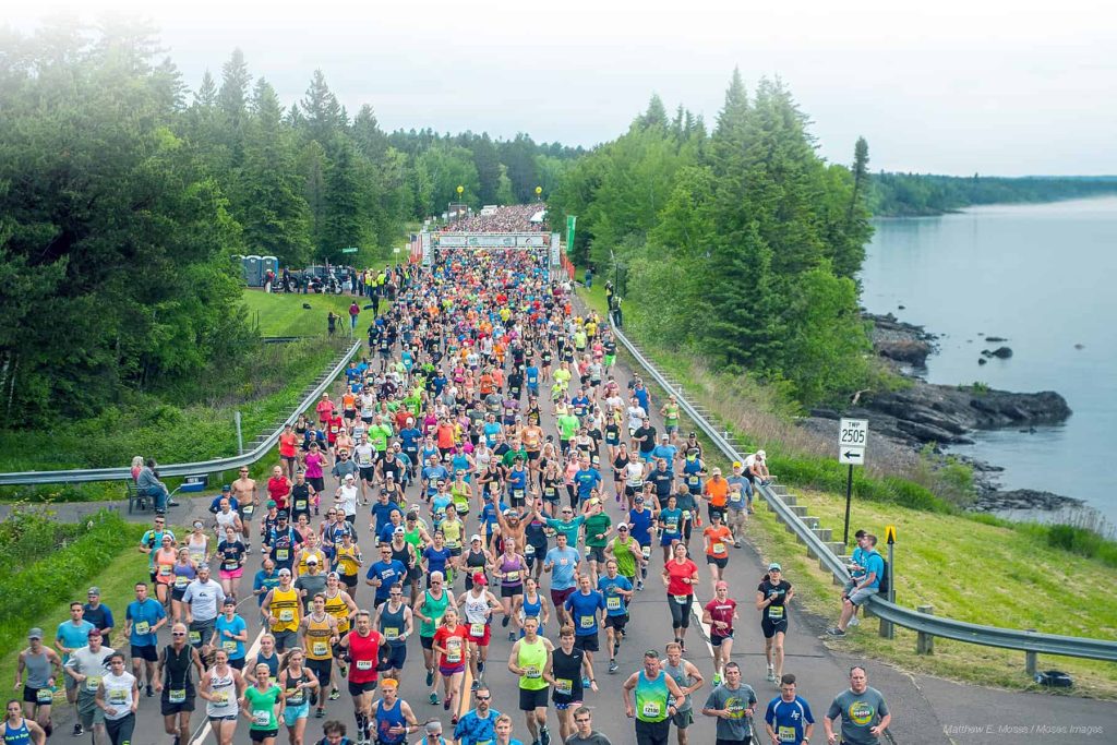 Grandma's Half Marathon starting line with thousands of runners.