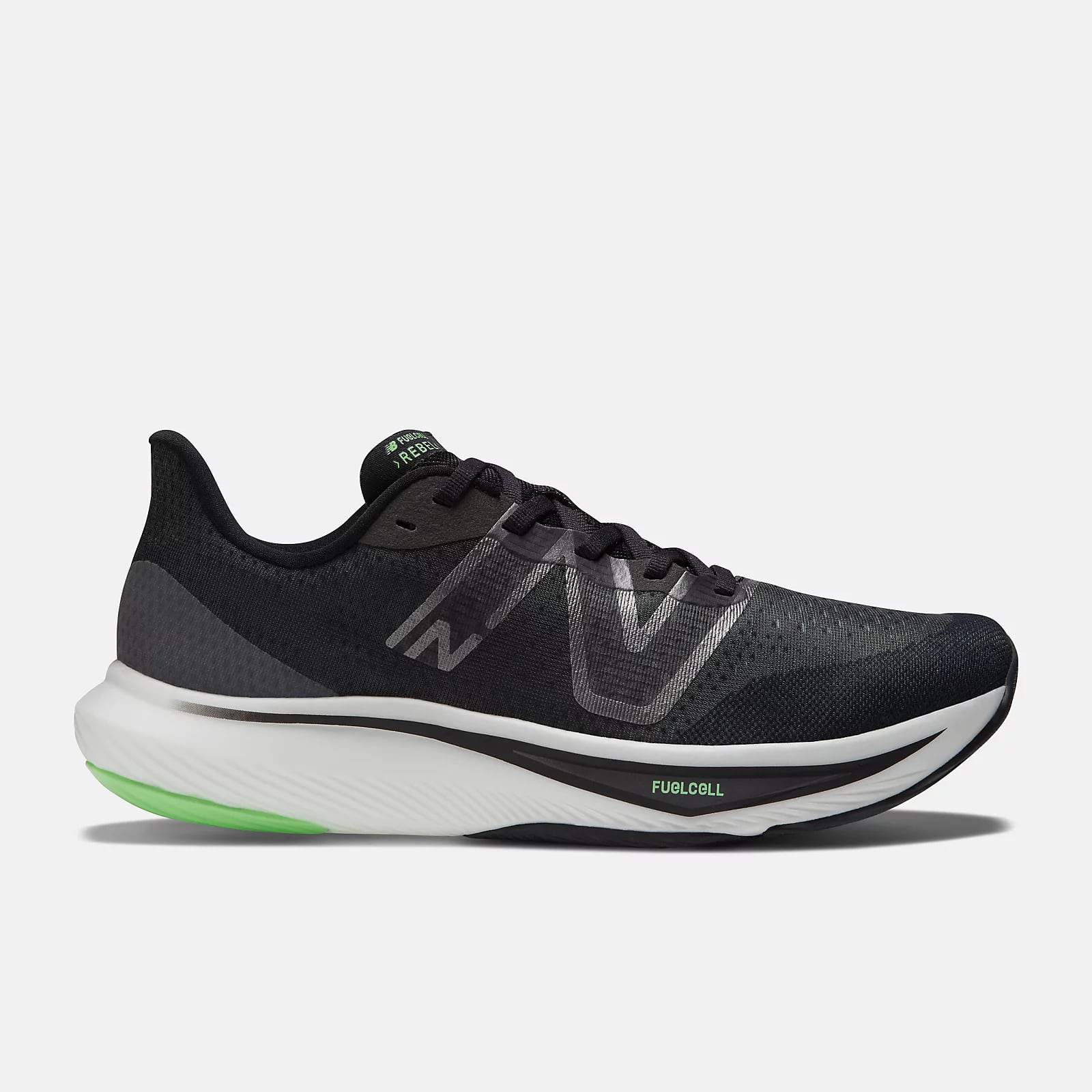 A black and charcoal grey running shoe with green and white accents. The shoe has the "N" logo on the side, a cushioned midsole with "FUELCELL" text, and a green-highlighted outsole. The design features a sleek and modern appearance.