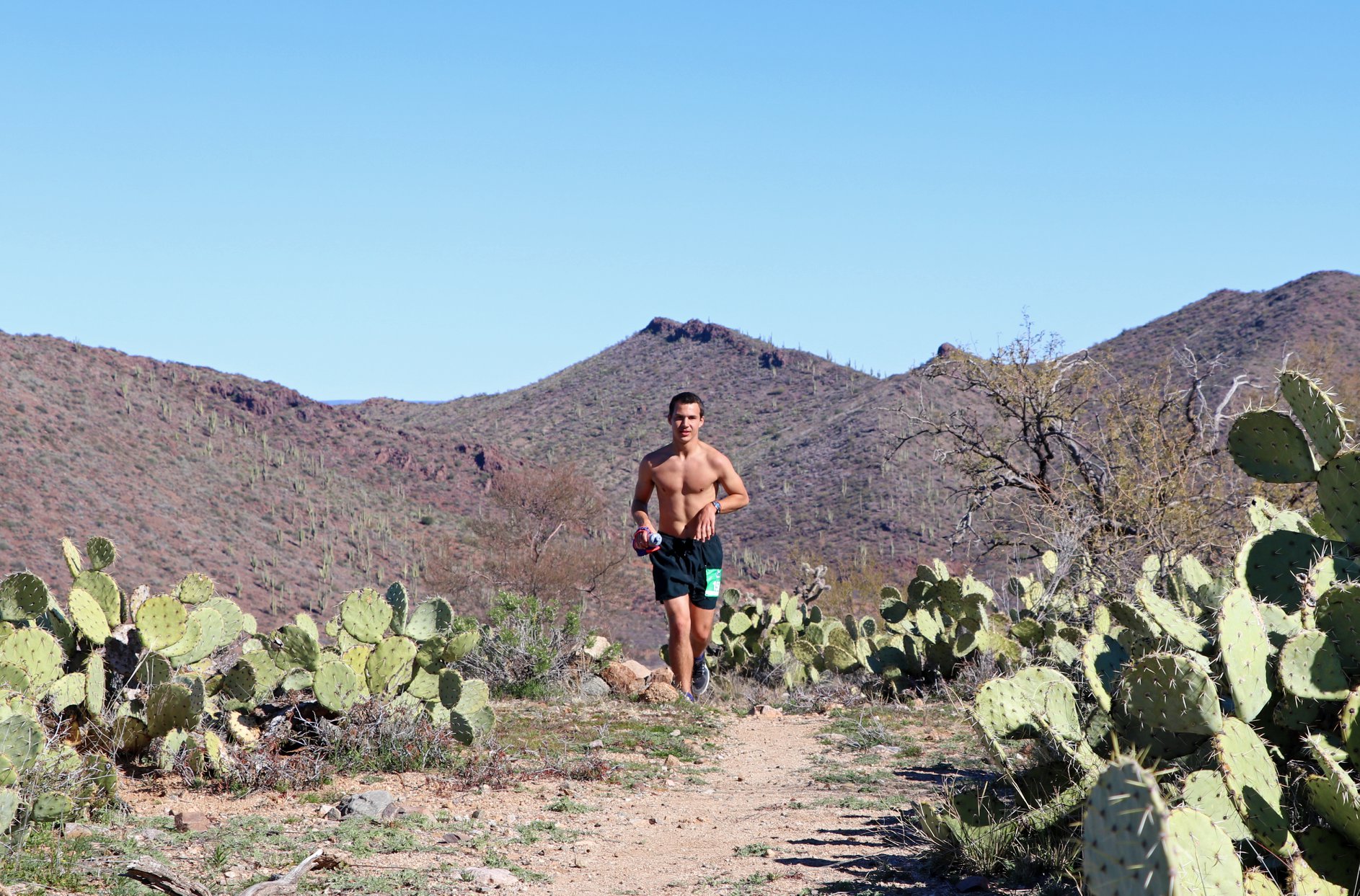 A runner in the course of AZT Oracle Rumble 50M 50k Half Marathon & 10k in Oracle, AZ