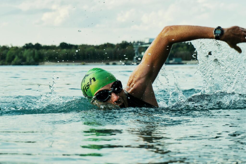 A runner cross-training by swimming in open water.