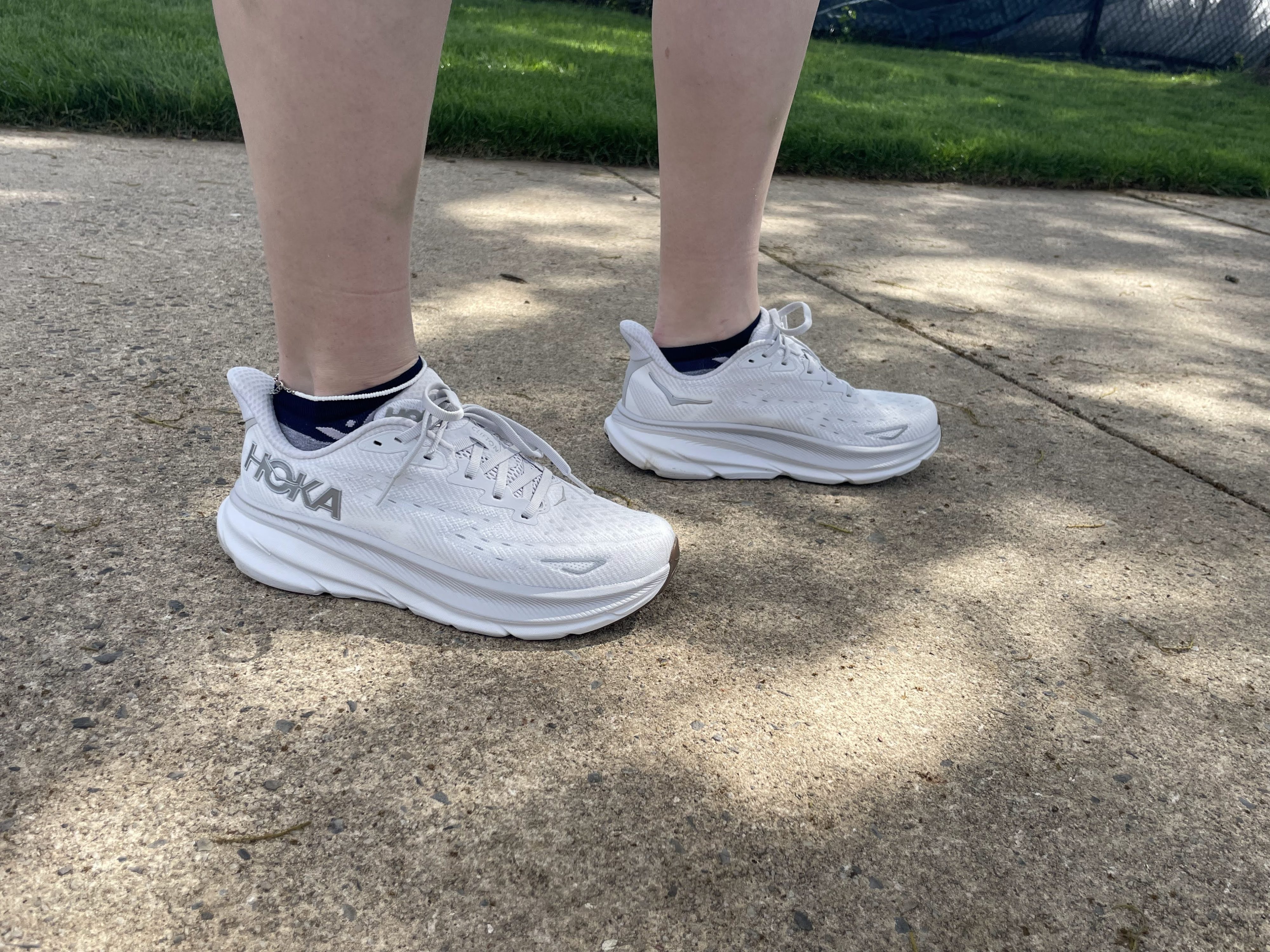 Writer Gabrielle Hondorp standing in the Hoka Clifton 9 running shoes during testing.