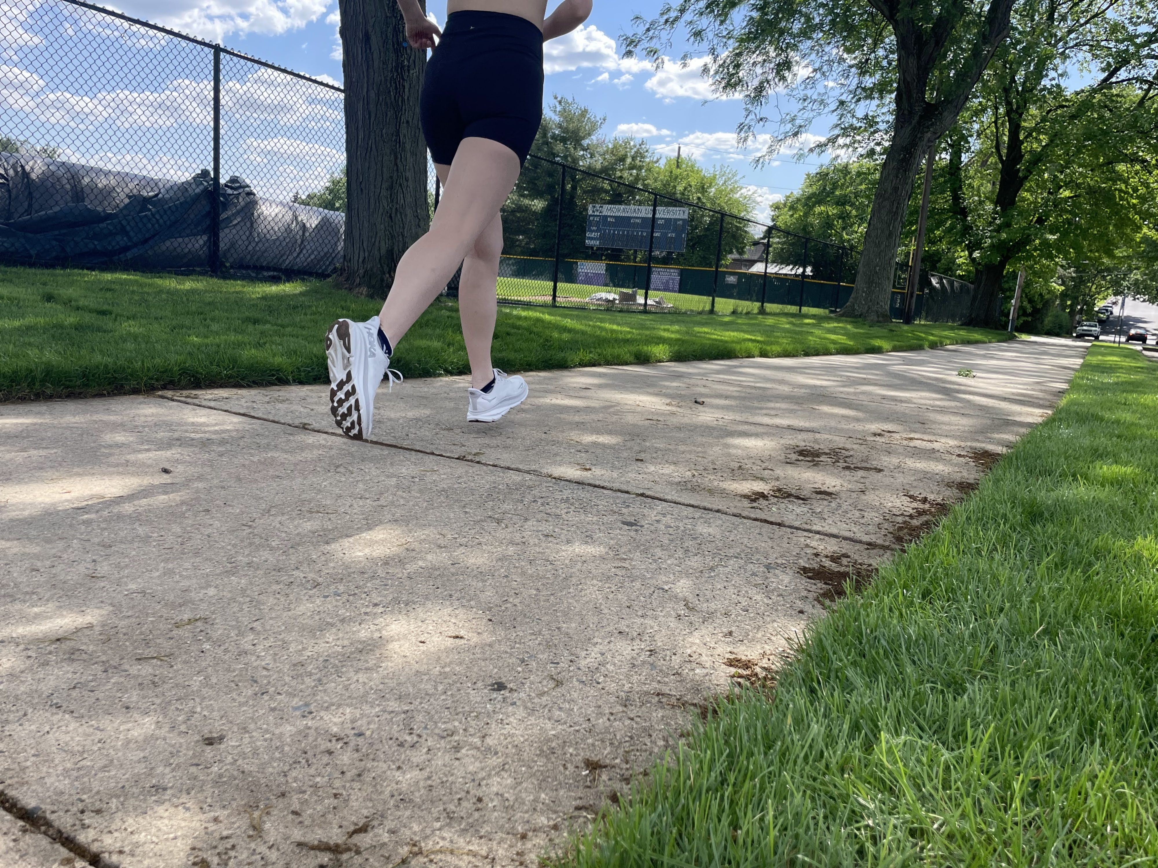 Writer Gabrielle Hondorp running in the Hoka Clifton 9 running shoes during testing for her gear review.