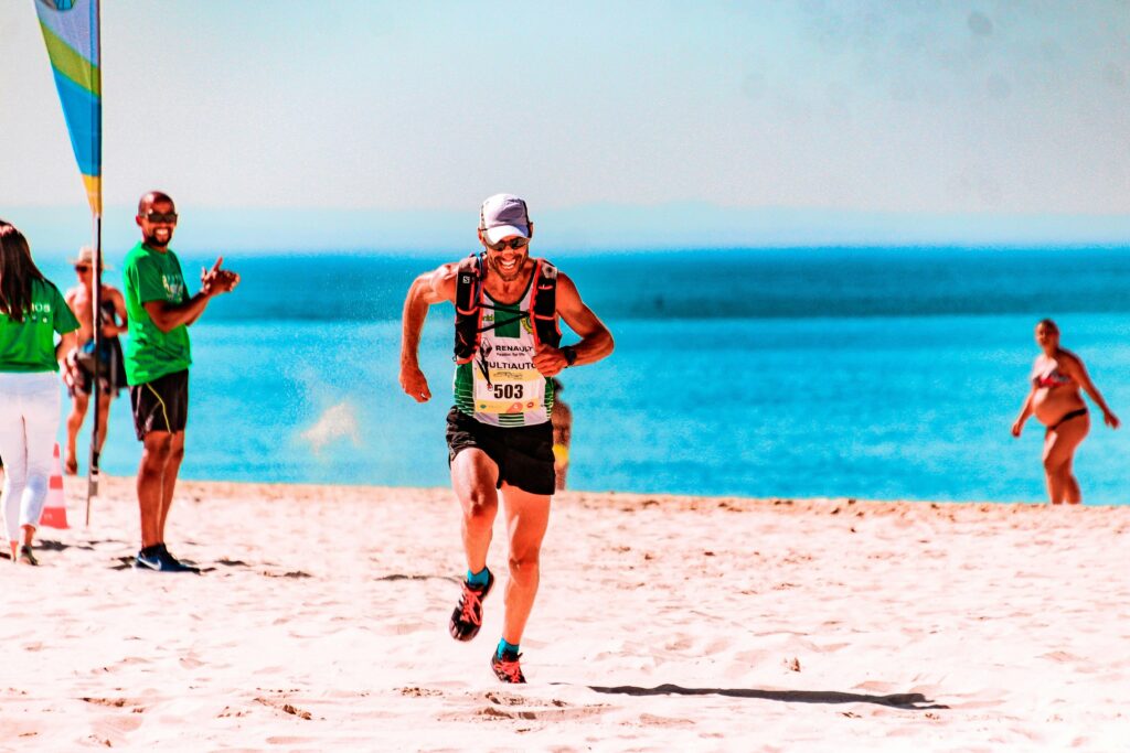 a man running a race on a beach